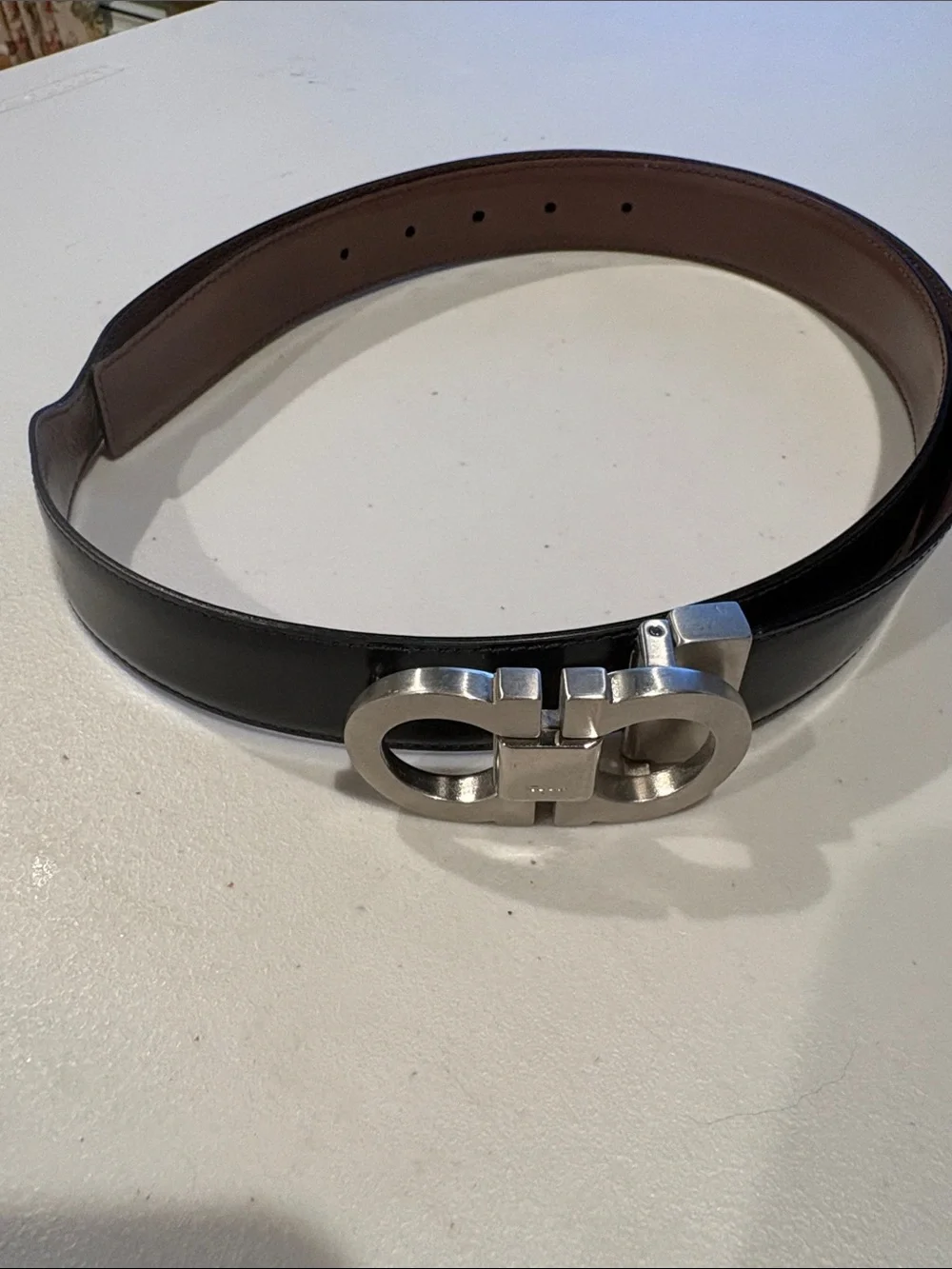 Salvatore Ferragamo Leather Gancini Belt with Silver Buckle. Size 42 black/brown